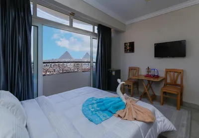 فندق صن رايز ( في قلب اهرامات الجيزة )متوفر غرف دبل تربل سنجل 